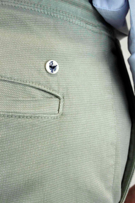 Chino trousers with olive-colored elastic bands