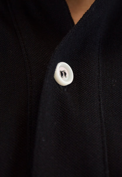 Polo negro de manga corta