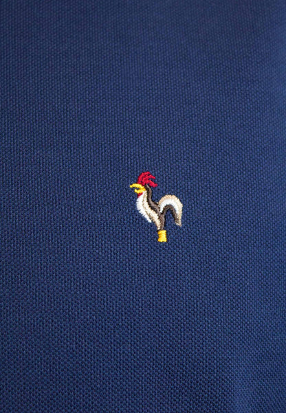 Polo petróleo de manga corta